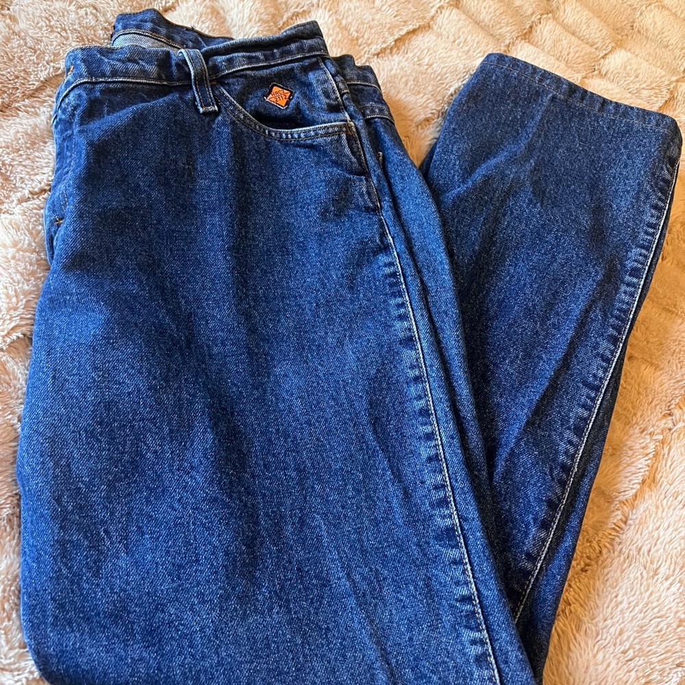 Wrangler Men's FR Jeans in Dark Blue.